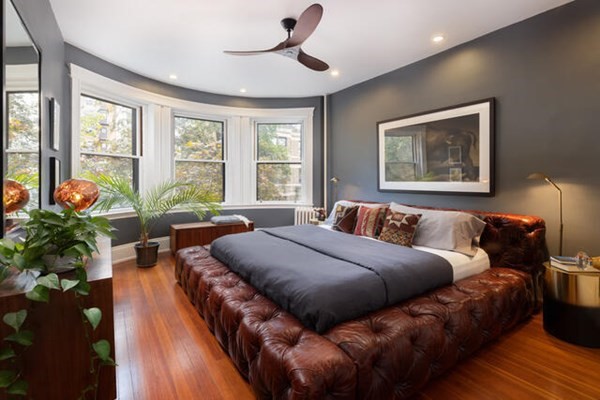 30 Powell Street, Unit 2 Brookline, MA 02446 - Photo 12 of 27 a bed room with bed and a potted plant