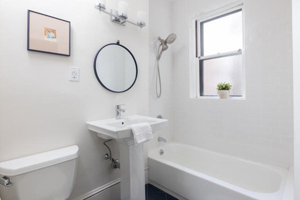 30 Powell Street, Unit 2 Brookline, MA 02446 - Photo 18 of 27 a bathroom with a sink a toilet and a bathtub