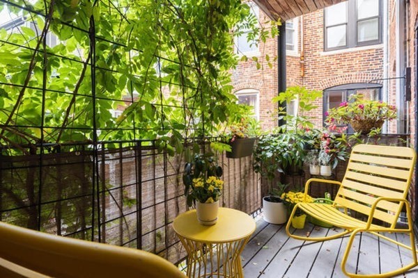 30 Powell Street, Unit 2 Brookline, MA 02446 - Photo 20 of 27 a view of a chairs and table in the balcony
