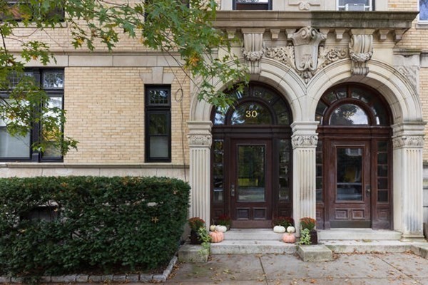 30 Powell Street, Unit 2 Brookline, MA 02446 - Photo 21 of 27 a view of entrance with wooden door and deck