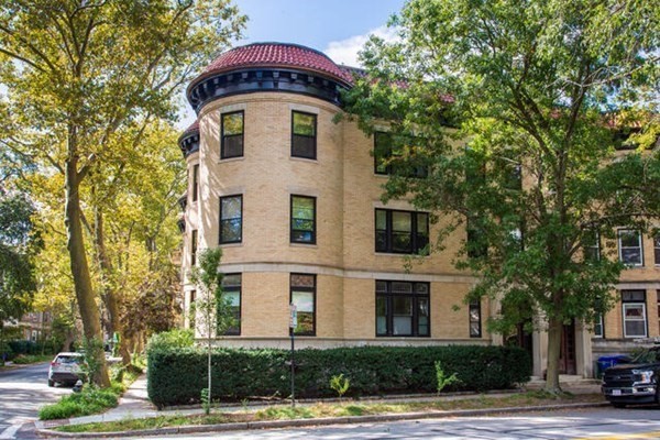 30 Powell Street, Unit 2 Brookline, MA 02446 - Photo 22 of 27 a front view of a house with a yard