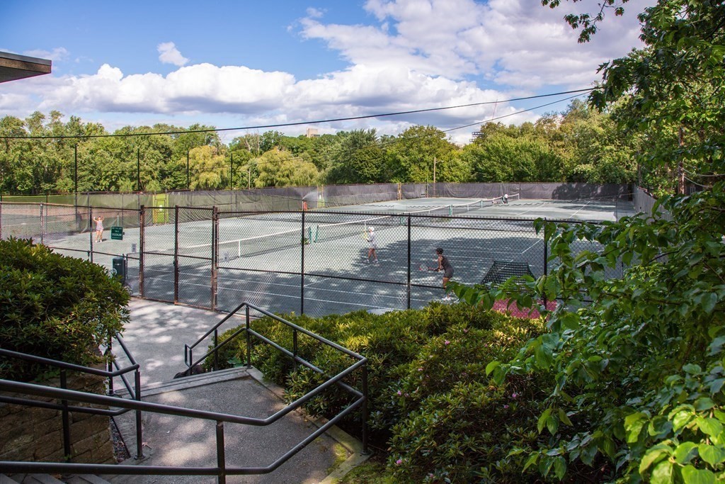 30 Powell Street, Unit 2 Brookline, MA 02446 - Photo 26 of 27 a view of a balcony with chairs and a potted plant