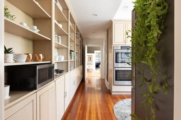 30 Powell Street, Unit 2 Brookline, MA 02446 - Photo 9 of 27 a view of a kitchen from the hallway