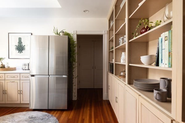 30 Powell Street, Unit 2 Brookline, MA 02446 - Photo 10 of 27 a kitchen with a refrigerator and cabinets