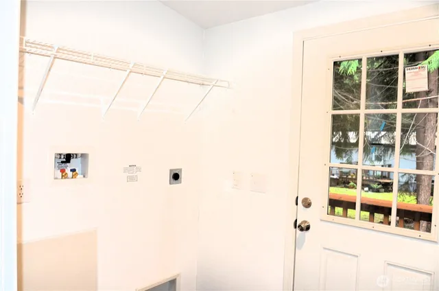 a room with a window and a shower