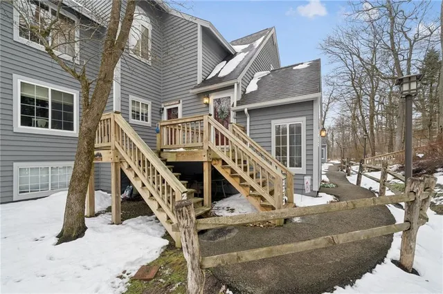 a view of a house with wooden stairs