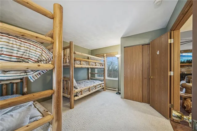 a bedroom with furniture and a window