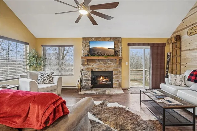 a bedroom with a bed and a fireplace