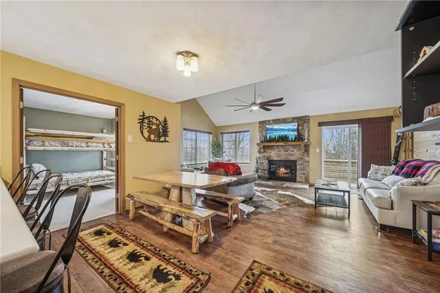 a living room with furniture gym equipment and a fireplace