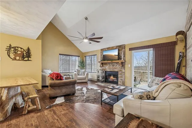 a living room with furniture fireplace and a flat screen tv