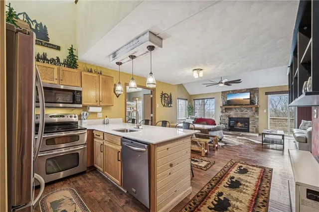 a kitchen with a sink stove and cabinets