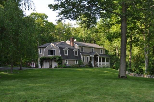 120 Pipers Hill Road Wilton, CT 06897 - Photo 1 of 1 a front view of a house with a garden