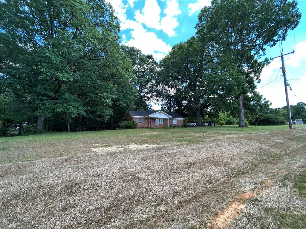 a view of a yard with a trees