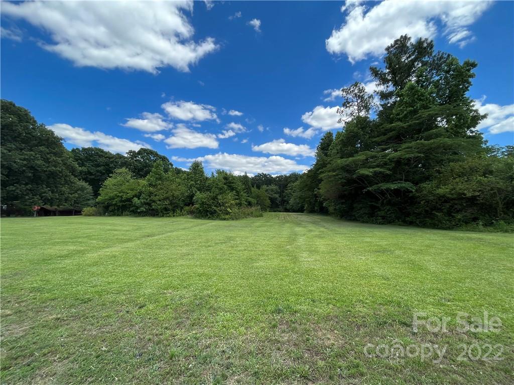 2108 Stallings Road Matthews, NC 28104 - Photo 2 of 9 a view of a big yard with lots of green space