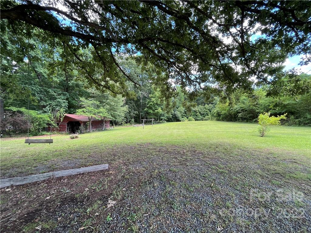 2108 Stallings Road Matthews, NC 28104 - Photo 7 of 9 a view of a garden with large trees