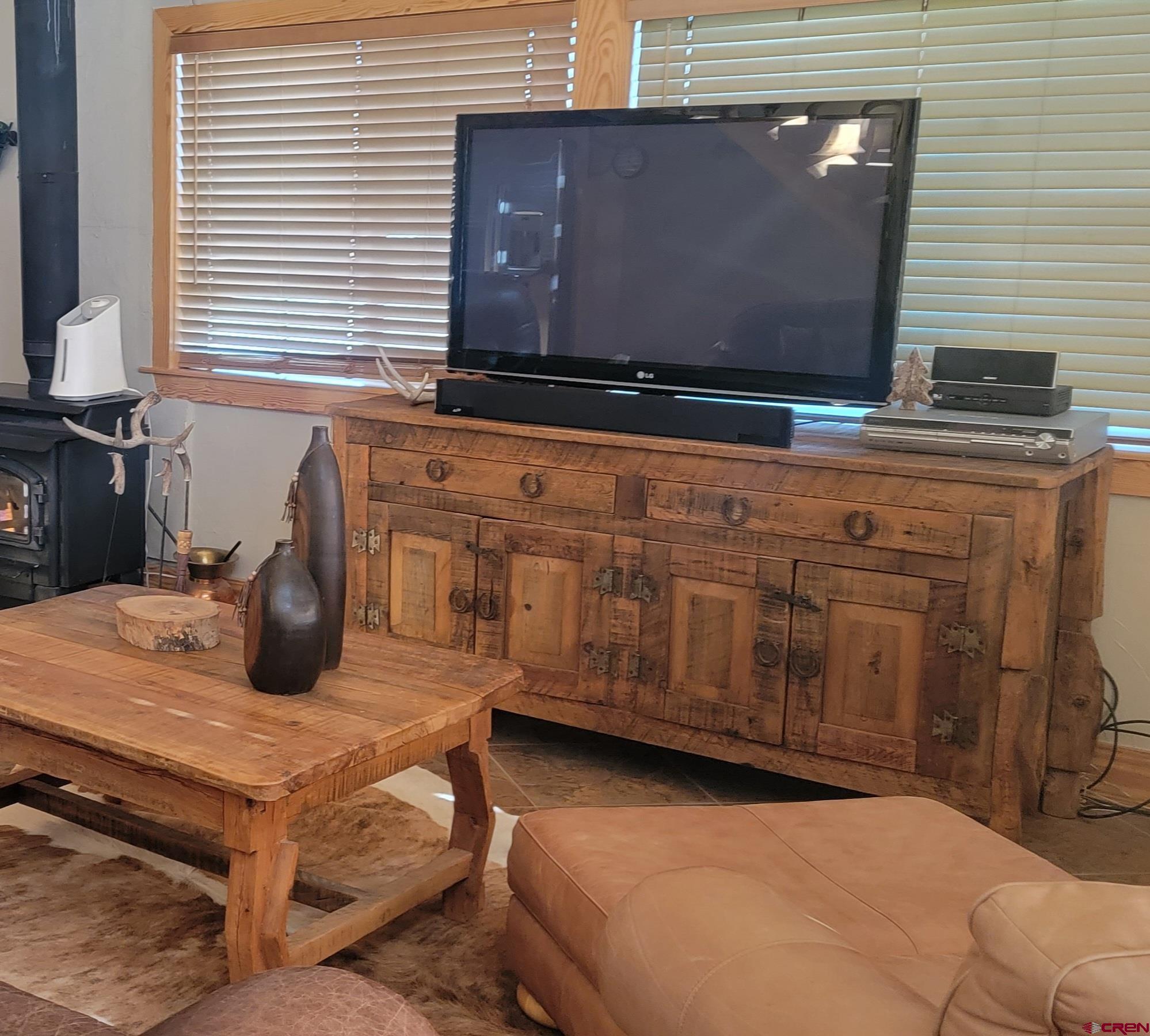 74 Owhi Road South Fork, CO 81154 - Photo 17 of 41 a kitchen with stainless steel appliances wooden cabinets and a stove top