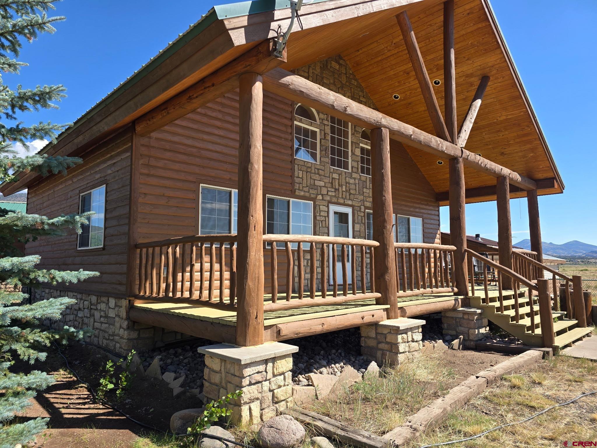 74 Owhi Road South Fork, CO 81154 - Photo 2 of 41 a front view of a house with balcony