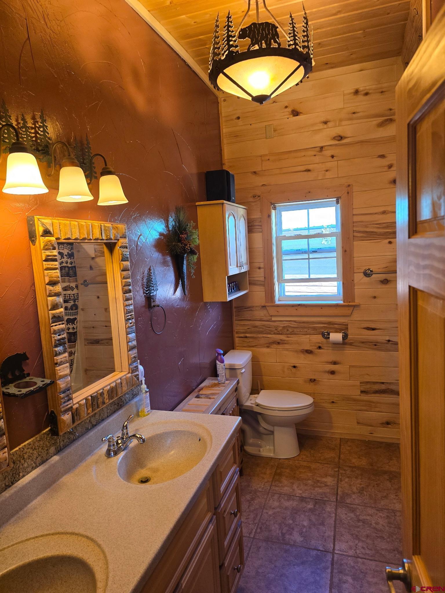 74 Owhi Road South Fork, CO 81154 - Photo 24 of 41 a bathroom with a sink and a mirror