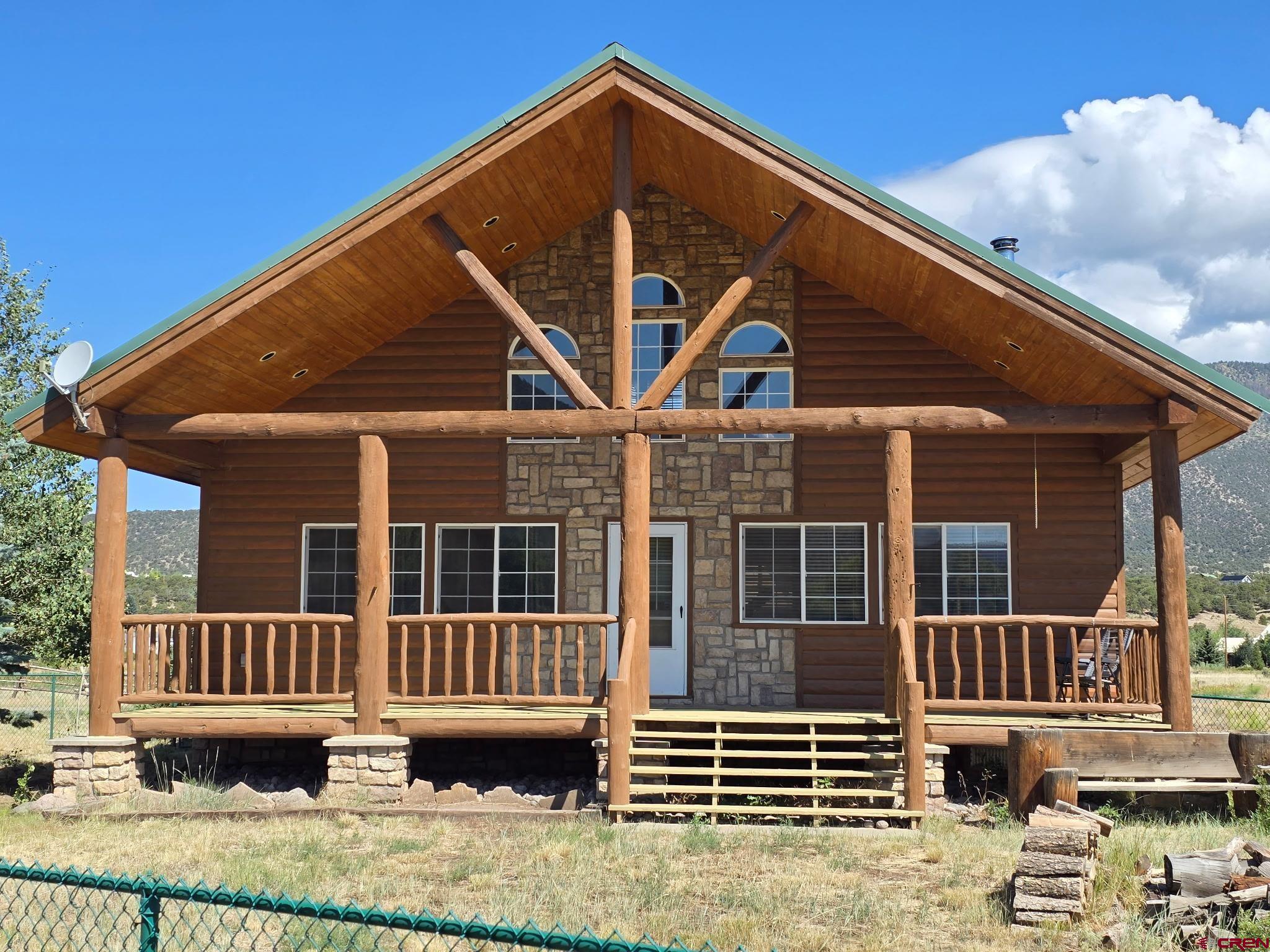 74 Owhi Road South Fork, CO 81154 - Photo 3 of 41 a front view of a house with a yard