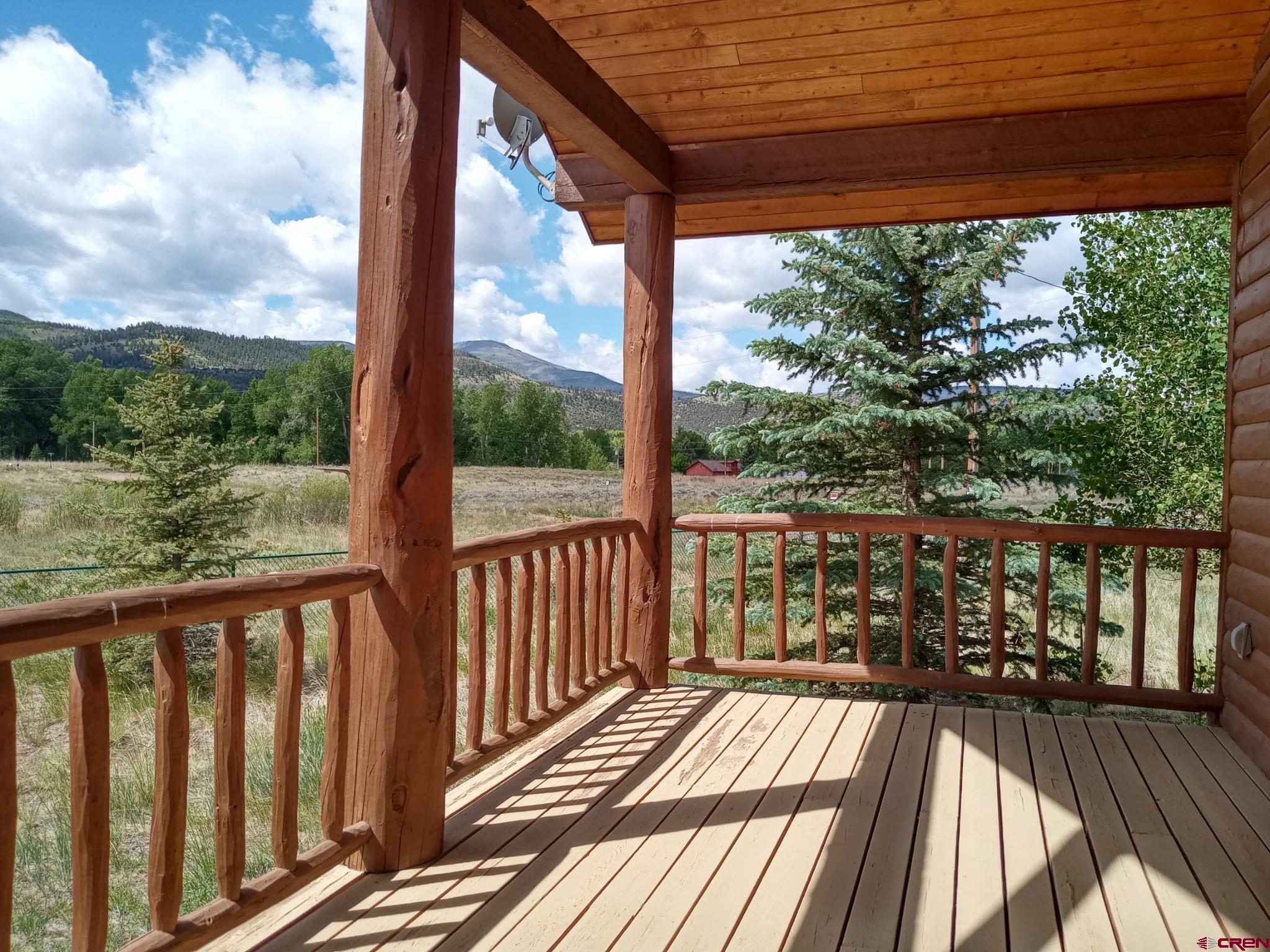 74 Owhi Road South Fork, CO 81154 - Photo 4 of 41 a view of balcony with wooden floor & fence