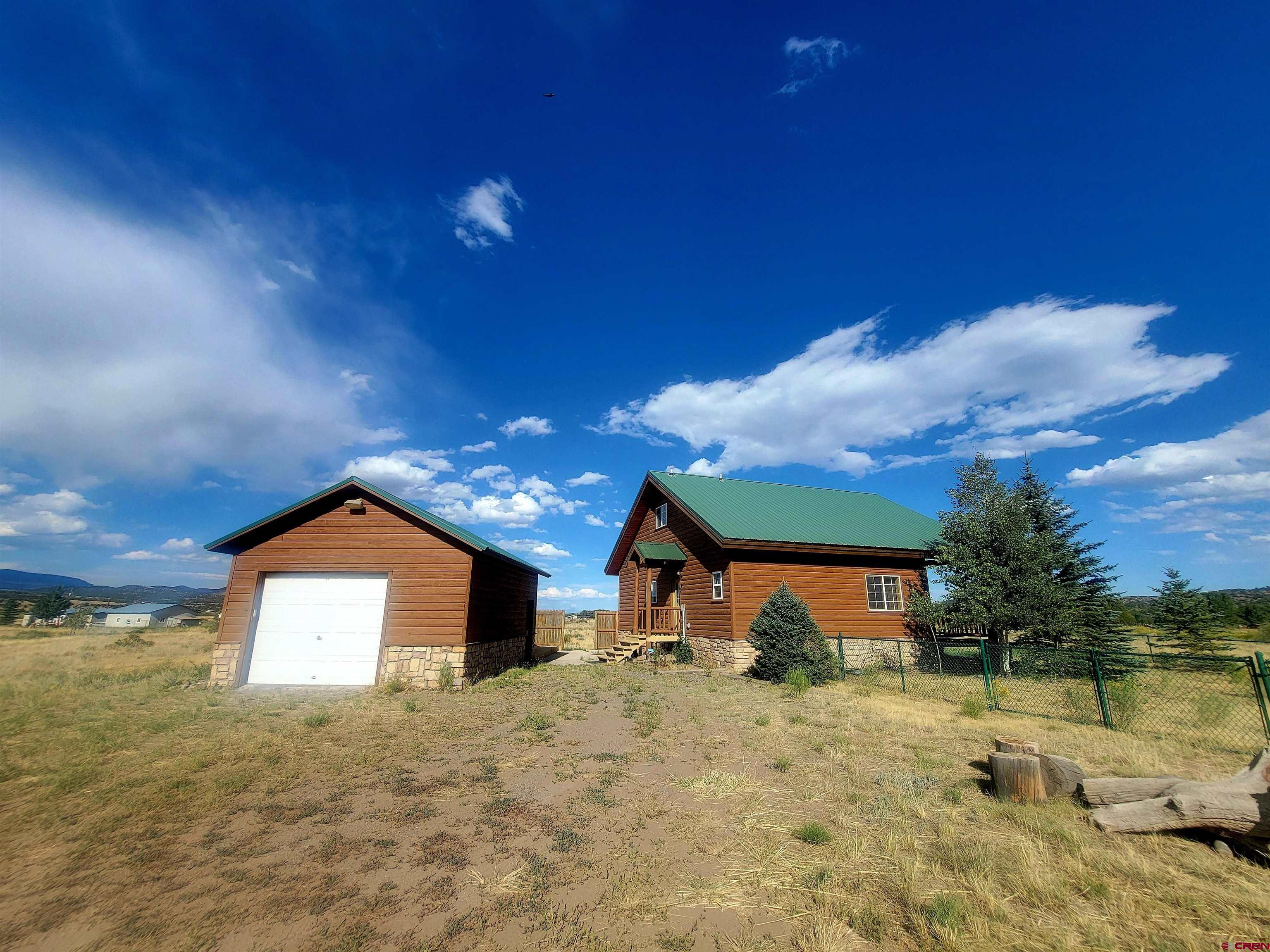 74 Owhi Road South Fork, CO 81154 - Photo 5 of 41 a view of a house with a yard