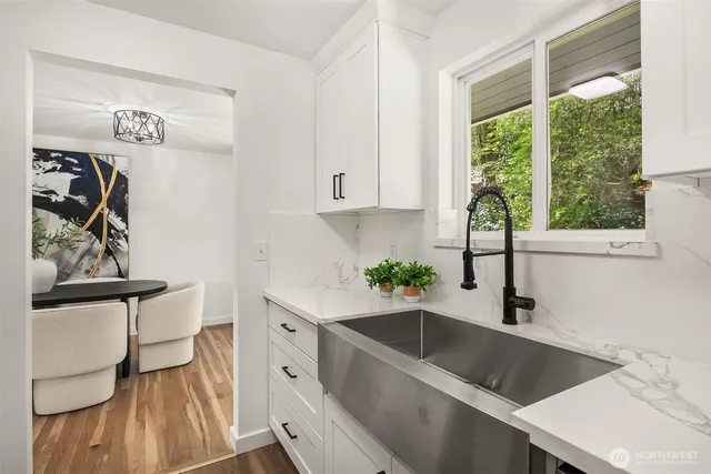 a kitchen with a sink and a window
