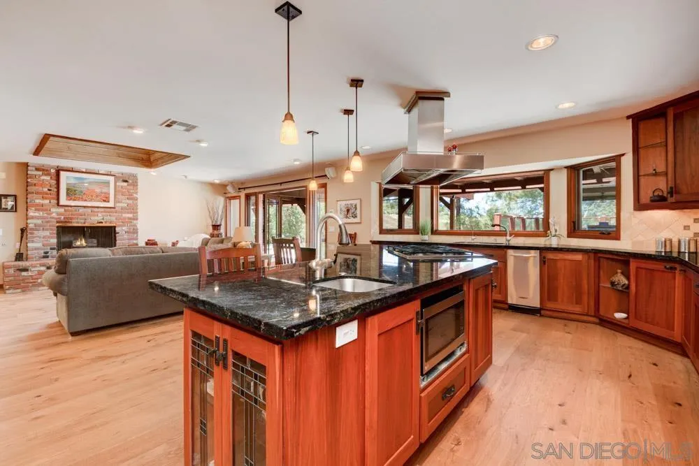 17758 Del Paso Drive Poway, CA 92064 - Photo 12 of 42 a kitchen that has a lot of cabinets in it