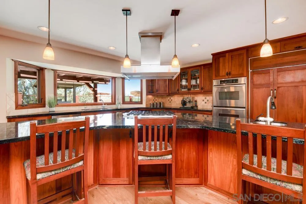 17758 Del Paso Drive Poway, CA 92064 - Photo 14 of 42 a dining room with furniture a window and wooden floor