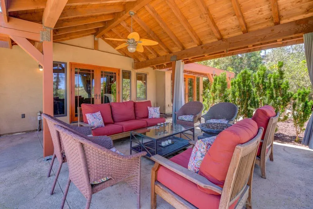 17758 Del Paso Drive Poway, CA 92064 - Photo 18 of 42 a living room with furniture a floor to ceiling windows and floor to ceiling window