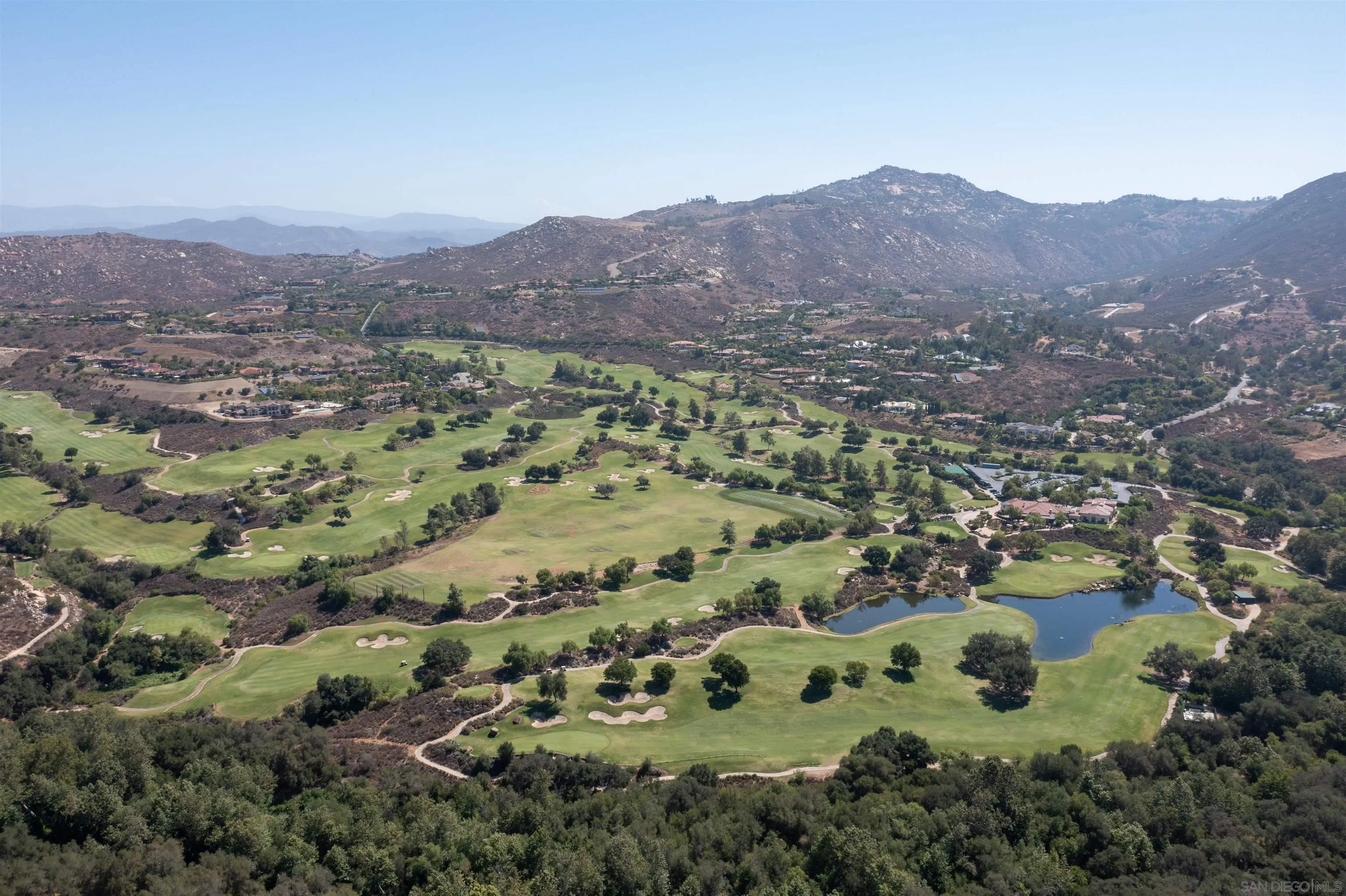 17758 Del Paso Drive Poway, CA 92064 - Photo 2 of 42 a view of a lush green hillside and houses