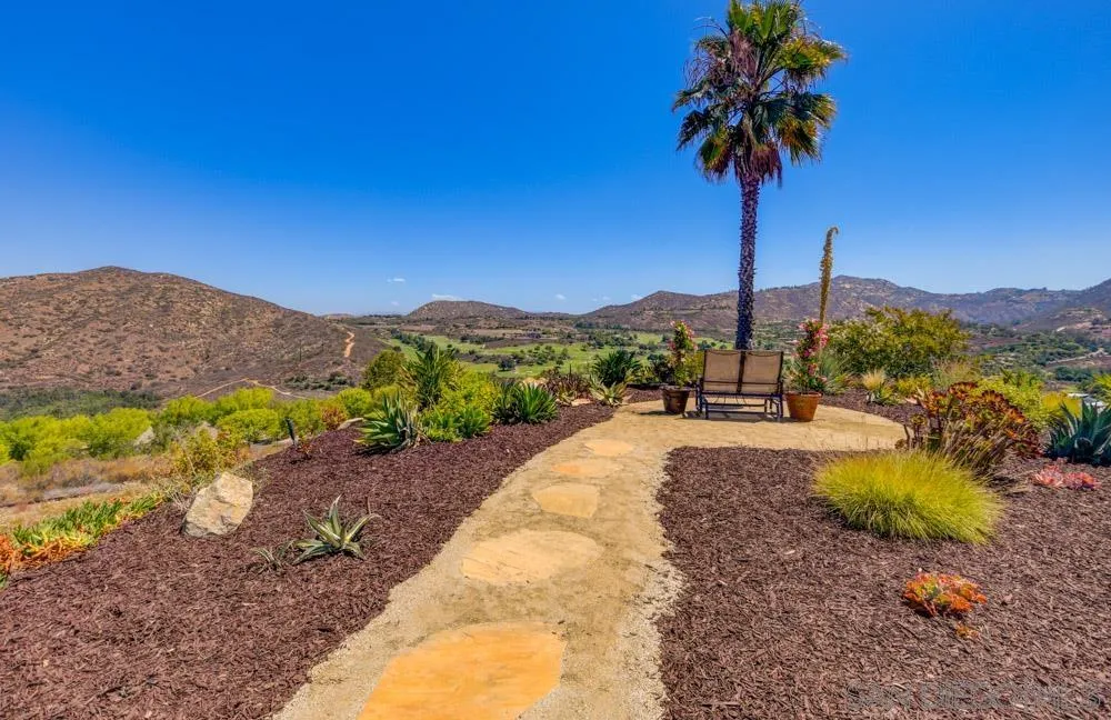 17758 Del Paso Drive Poway, CA 92064 - Photo 29 of 42 a view of a lake with a mountain in the background