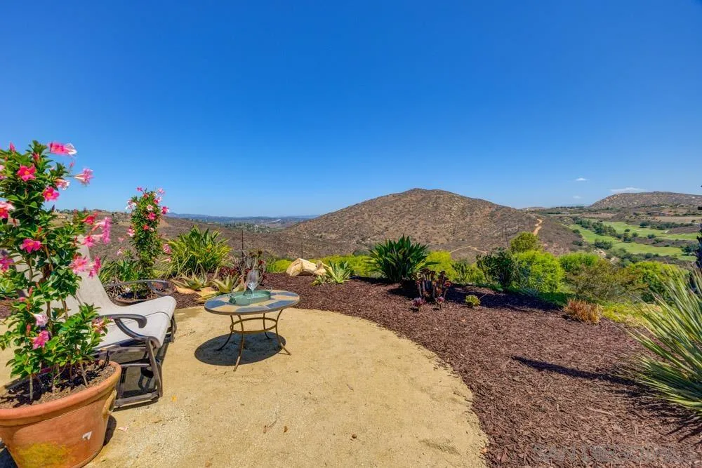 17758 Del Paso Drive Poway, CA 92064 - Photo 31 of 42 a view of a backyard with plants and a garden