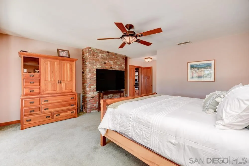 17758 Del Paso Drive Poway, CA 92064 - Photo 34 of 42 a bedroom with a bed and a flat screen tv