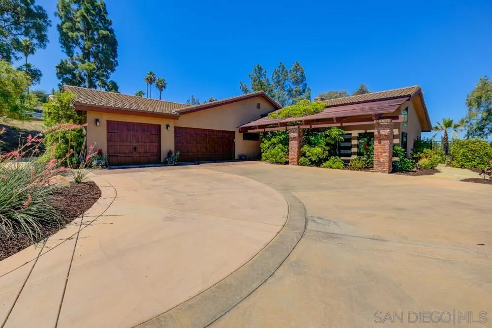 17758 Del Paso Drive Poway, CA 92064 - Photo 4 of 42 a front view of a house with a yard and outdoor seating