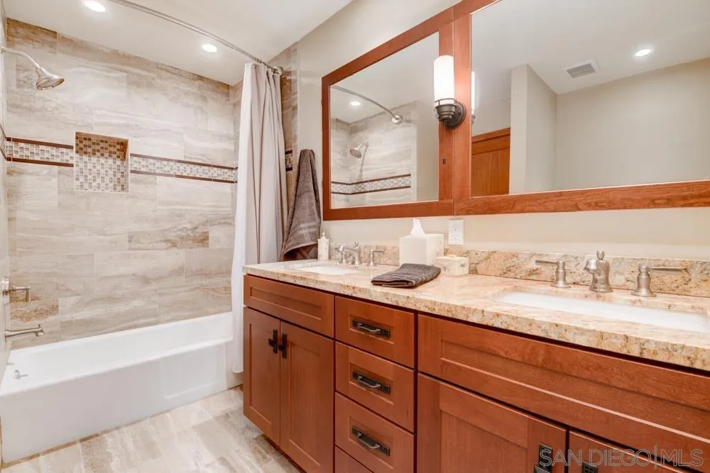 17758 Del Paso Drive Poway, CA 92064 - Photo 42 of 42 a bathroom with a granite countertop sink mirror and a bath