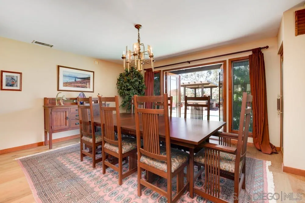 17758 Del Paso Drive Poway, CA 92064 - Photo 7 of 42 a view of a dining room with furniture window and wooden floor