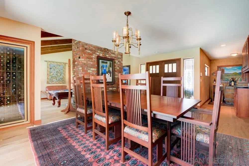 17758 Del Paso Drive Poway, CA 92064 - Photo 8 of 42 a view of a dining room with furniture and wooden floor