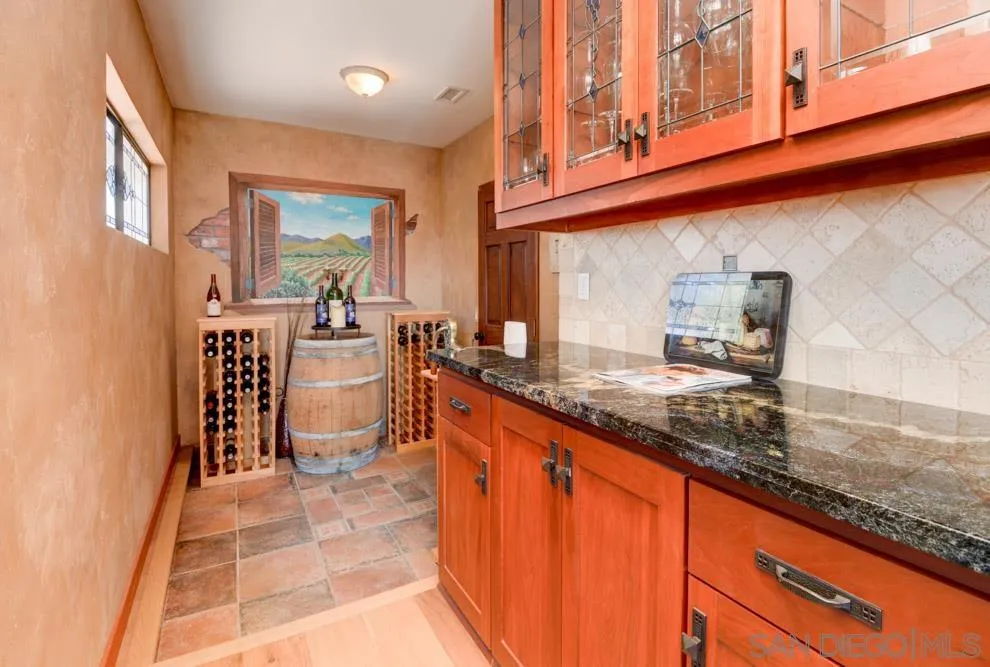 17758 Del Paso Drive Poway, CA 92064 - Photo 9 of 42 a kitchen with stainless steel appliances granite countertop a sink and cabinets