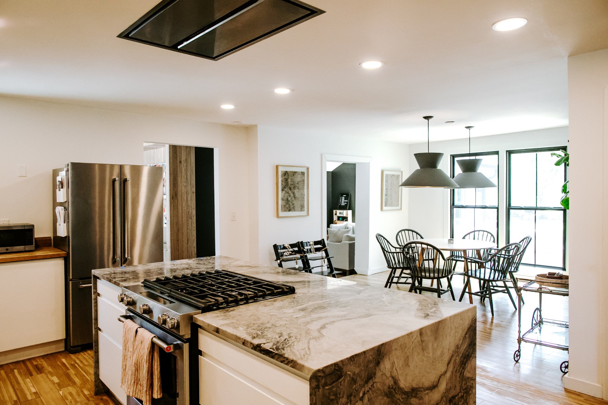 131 Baltusrol Road Franklin, TN 37069 - Photo 12 of 42 a kitchen with stainless steel appliances kitchen island granite countertop a table chairs and a refrigerator