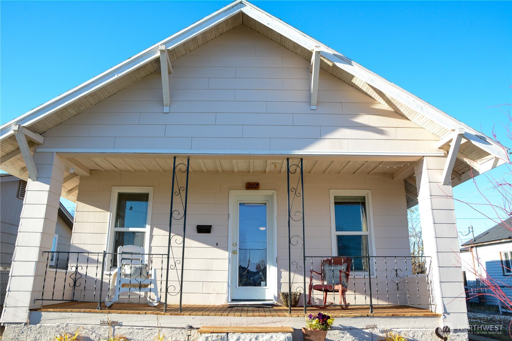 a front view of a house with a garage