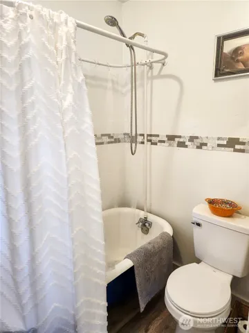 a white toilet sitting next to a bathroom sink