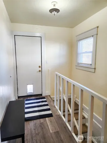 a view of entryway with wooden floor