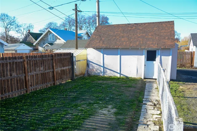 a view of house with backyard and entertaining space