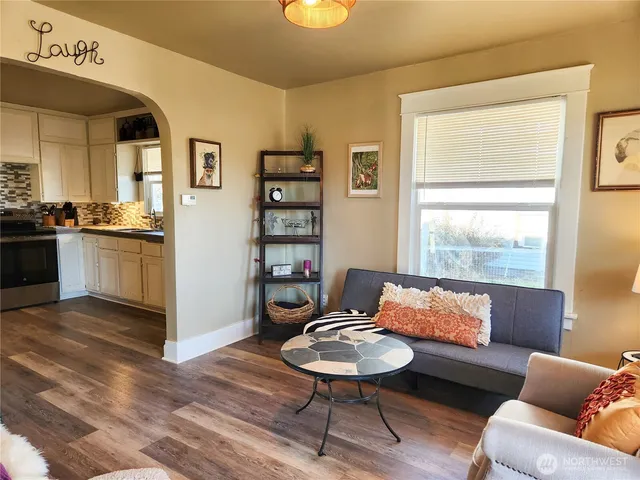 a living room with furniture and a window