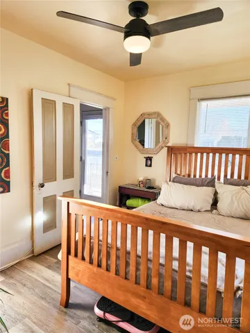 a bedroom with furniture and a window