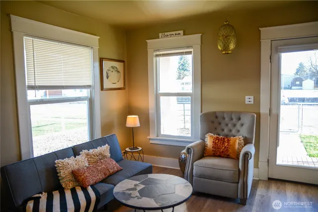 a living room with furniture and a window