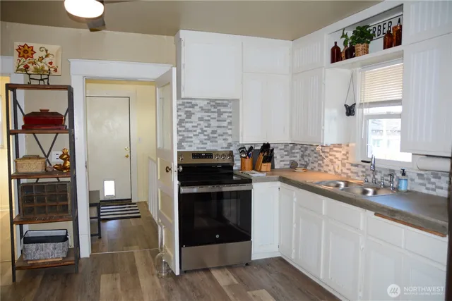 a kitchen with a sink and cabinets