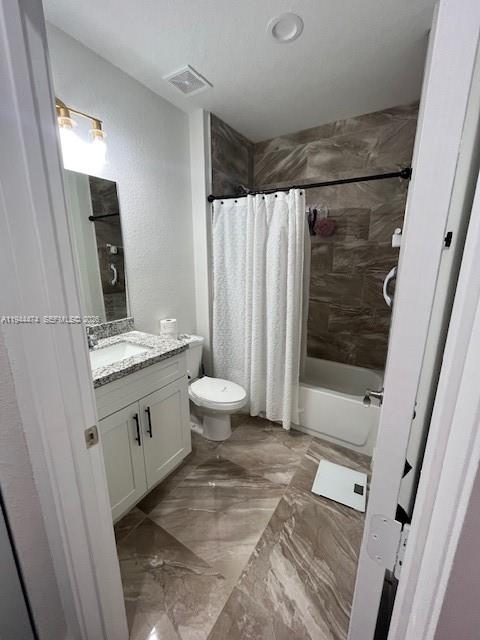 12980 Southwest 246th Street, Unit 206 Homestead, FL 33032 - Photo 2 of 5 a bathroom with a granite countertop sink toilet and shower