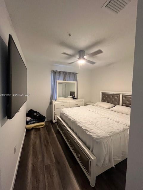 12980 Southwest 246th Street, Unit 206 Homestead, FL 33032 - Photo 3 of 5 a bedroom with a bed and a walk in closet