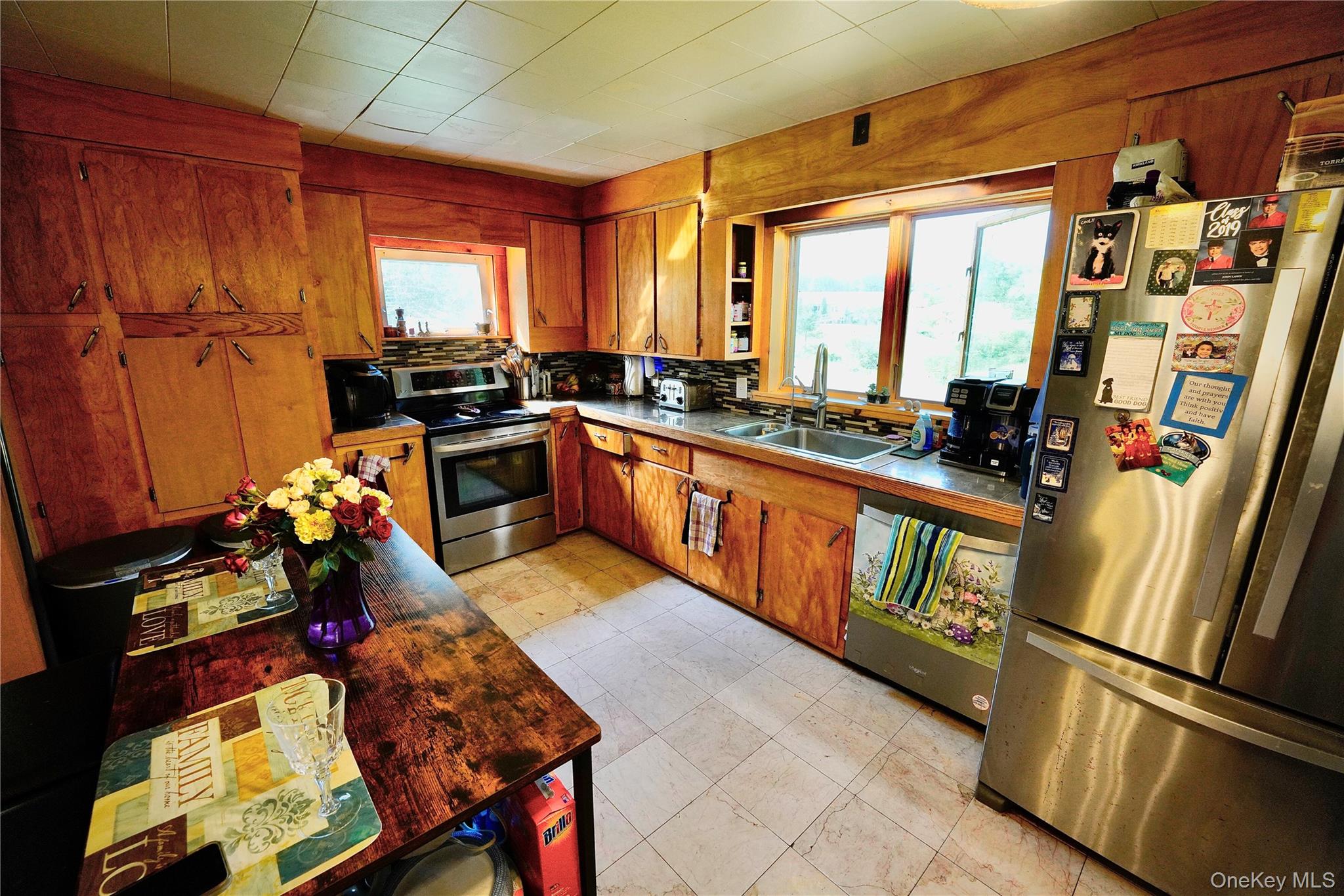 669 Shandelee Road Livingston Manor, NY 12758 - Photo 19 of 46 a kitchen with a refrigerator and a stove